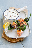 Grilled salmon and shishito pepper skewers