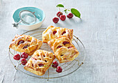 Cherry pastries on cooling rack