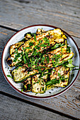 Grilled courgette slices with herbs
