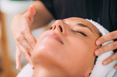 Ayurvedic face massage with essential aromatherapy oils