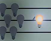 Man pushing lit light bulb, illustration