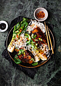 Korean style beef ribs with bok choi and rice noodles