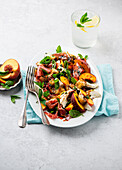 Mozzarella salad with nectarines, prosciutto and herb dressing
