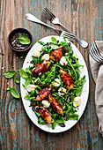 Summer salad with nectarines wrapped in Parma ham and mozzarella cheese