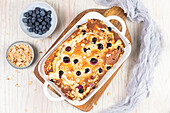 Sweet casserole with ricotta, egg, almonds and blueberries