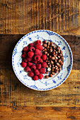Still life with raspberries and nuts