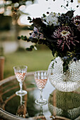 Crystal wineglasses on table in garden