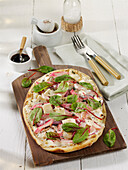 Tarte flambée with rhubarb, baby chard and goat's cheese