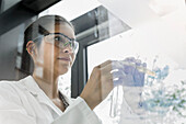 Female scientist working in laboratory, Munich, Bavaria, Germany