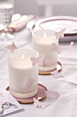 Paper butterflies decorating candels