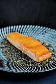Caramelised salmon on beluga lentil salad