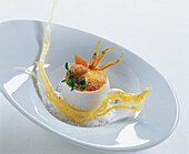 Sot-l'y-laisse in carrot broth with cumin crackers