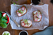 Open-Faced Sandwiches for breakfast with cream cheese, radishes, and watercress