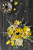 Lush yellow flower arrangement bundt cake pan on black boards