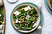 Asparagus and pea salad with ricotta and walnuts