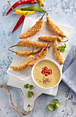 Fried spicy chili peppers with Cheddar dip
