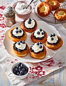 Doughnuts with custard and blueberries