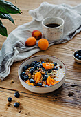 Chocolate porridge with blueberries and apricots