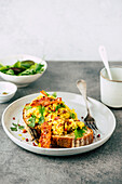 Scrambled eggs and bacon on toast