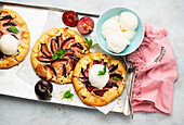 Small galette with plums and lemon ice cream