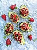 Grilled avocados with strawberry salad