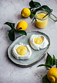 Lemon Curd spooned in meringue nests