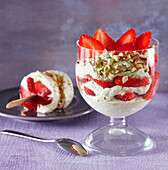 Layered dessert with avocado cream and strawberries