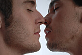 Young male couple about to kiss
