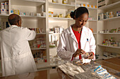 Pharmacist assistant sorts drugs into categories