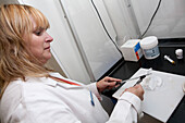 Pharmacist preparing drug for patient use