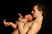 Man holding baby