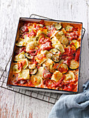 Oven-baked ravioli with courgettes and tomatoes