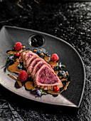 Roasted ostrich fillet with wild berries and rosemary