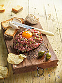 Steak tartare with hot peppers and capers