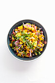 Mango salad with onions and herbs