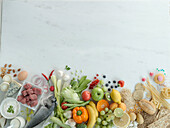 Various foodstuffs arranged around the edge of the picture