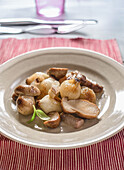 Roasted porcini mushrooms with small onions