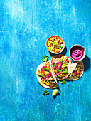 Pulled pork tacos with charred corn salsa and pickled onions