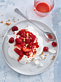 Meringue with red fruits and currant sauce