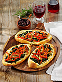 Coca Mallorquina - pizza flatbread with spinach and peppers