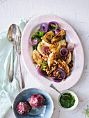 Braised fennel with herb pesto and red onions