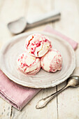 Yoghurt ice cream marbled with redcurrant syrup