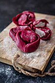 Beetroot tortellini with goat's cheese truffle filling