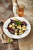 Orechiette with roasted radicchio and pear vegetables with olives