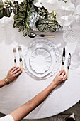Elegant place setting and flower decoration on table