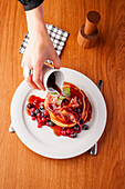 Black Forest Canada Pancakes with bacon and maple syrup