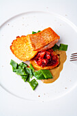 Fillet of golden trout with corn crêpes, cherry-apricot chutney and curry sauce