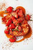 Brioche French toast with strawberries and maple syrup