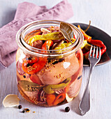 Spicy pickled sausage in marinade