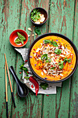 Asian Style pumpkin soup with coconut milk, ginger and rice noodles